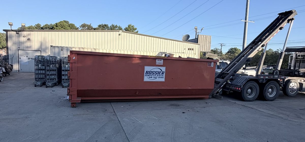 Bossier Dumpster Rental container set at a warehouse loading area